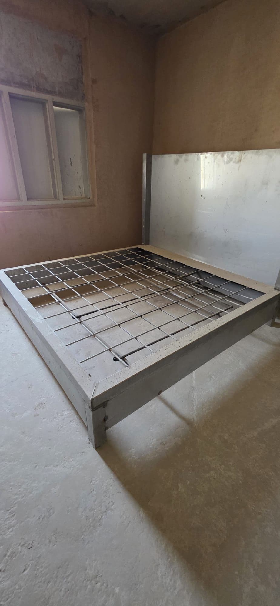 A steel fire tray prop inside a training building.